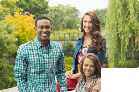 3 teens smiling with straight white teeth after finishing Clear Braces treatment.