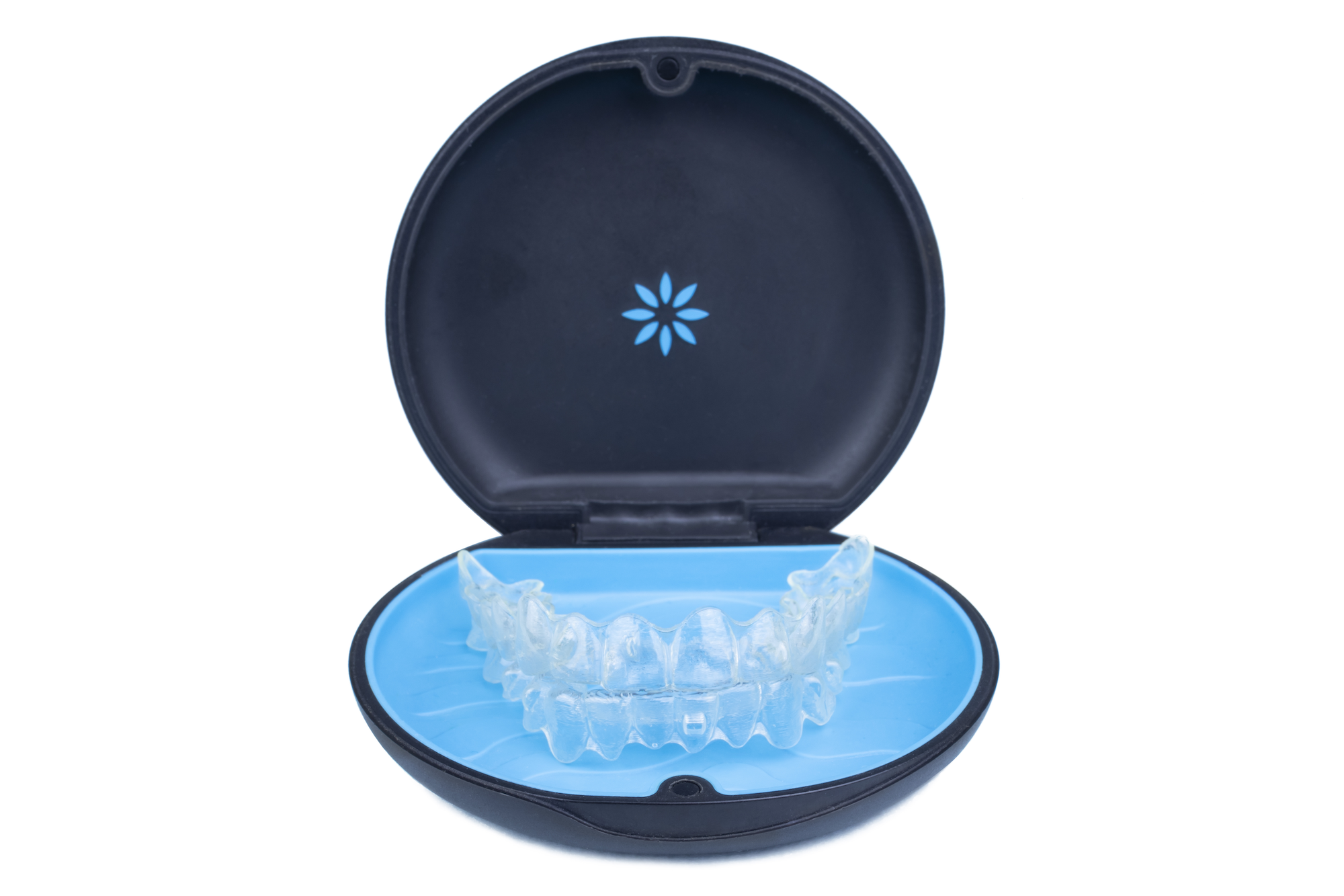 Invisalign clear aligners displayed in an open carrying case.