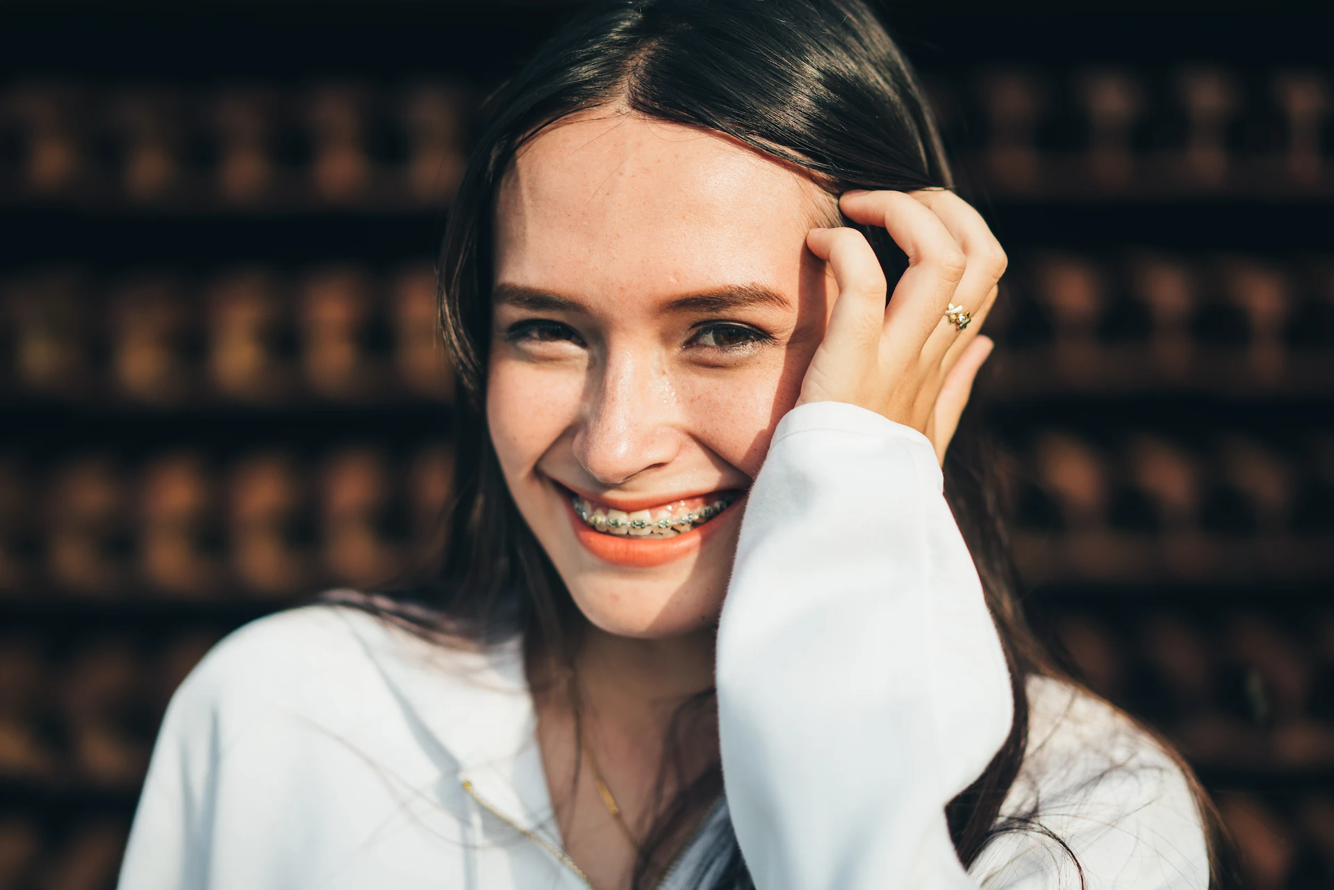 Smiling teenage girl in braces.