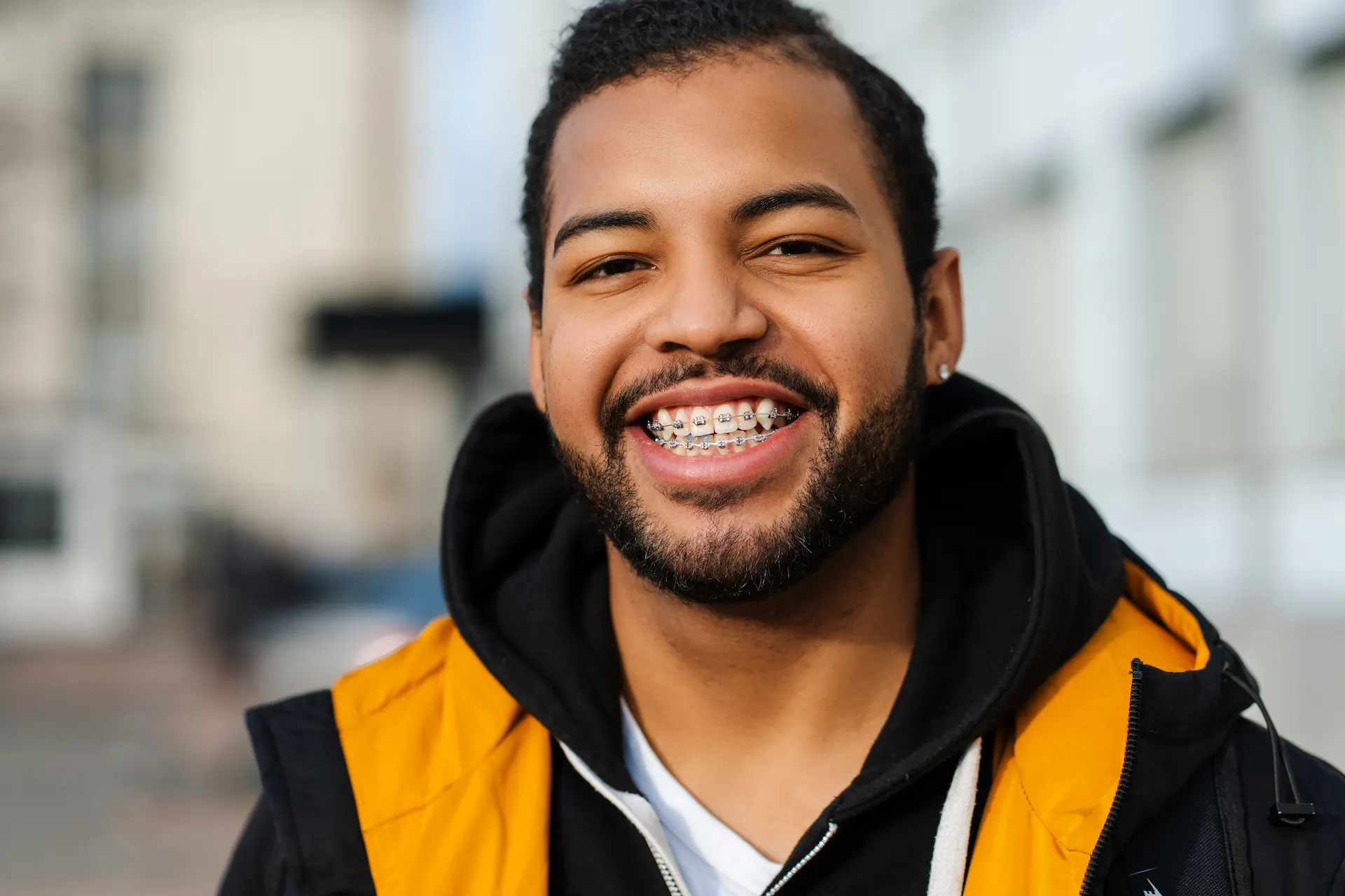 Smiling African American teen wearing braces.